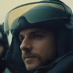 a man wearing ski goggles and a helmet