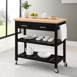 the black kitchen cart is holding three dishes