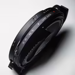 an empty lens sitting on a white surface