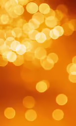 a yellow and red boke of light that is very bright