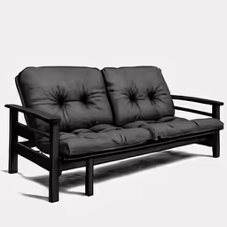a black couch with four cushions and an unfinished frame
