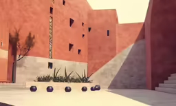 several black pots on the floor in front of a tall red building
