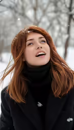 the woman in black coat is smiling in the snow