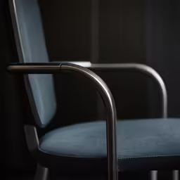 a blue and black chair that has no arms