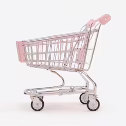 an empty shopping cart that is pink