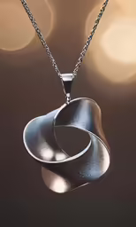 a small pendant is shown on a chain