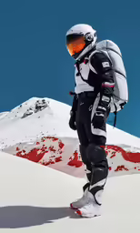 a man in ski gear standing in front of a mountain