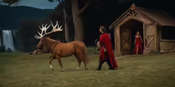 a man in a red dress is leading a horse