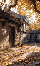 an old house with a brick sidewalk and yellow leaves on the ground