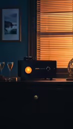 there is a radio in the room and glasses in front