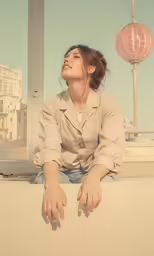 a person is sitting and looking up at a sky