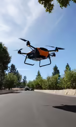a small black and orange toy flying in the air above a street