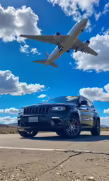 a large jet flies in the sky over a parked jeep