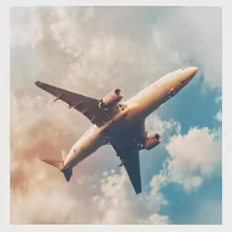 a airplane flying through the sky in the cloudy sky