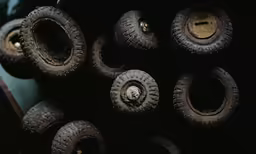 a bunch of tires and wheels in the dark