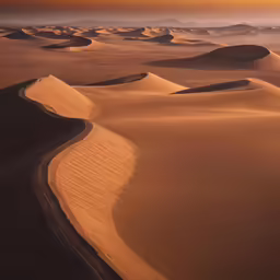 some desert with sand dunes and some clouds
