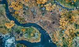 a aerial view of a lake and forest