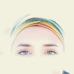 the woman has her eyes open while wearing a towel on her head