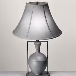 a table lamp with a grey ceramic base