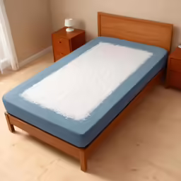 an open mattress and night stand in a bedroom