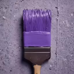 a brush with purple bristles on a sidewalk