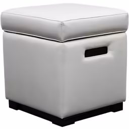 a white square ottoman with dark wood legs