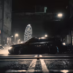 a car is parked near a lighted christmas tree