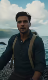 a man standing next to the ocean on top of rocks