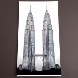 a photo in a paper on a table with the view of a tall building
