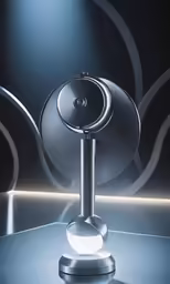 a bluetooth speaker sits on top of a black and silver surface