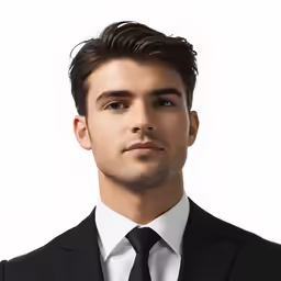 a young man dressed in a suit posing for a photograph