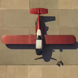 an aerial view of an airplane that is sitting in the cement