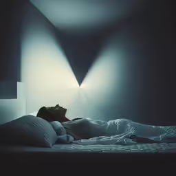 woman in bed with an extremely long white bed spread and lights