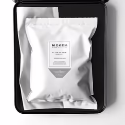 an open box with a package of coffee on it