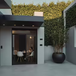 some white chairs sitting on a cement patio