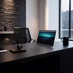 a large black table with a laptop on it