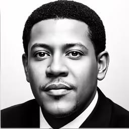 a close up of a person wearing a suit and tie