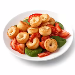 some strawberries on top of fried snacks
