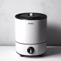 an electric kettle with a black lid