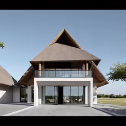 a home with glass walls and a large roof