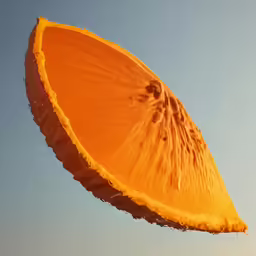 an orange umbrella is floating against the blue sky