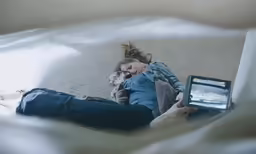 a couple of girls that are laying on the floor