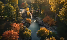 a large river surrounded by green trees and yellow and red leaves