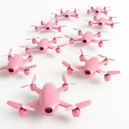 small pink toy airplanes on a white surface