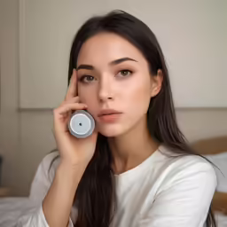 a young woman is posing while holding a clock