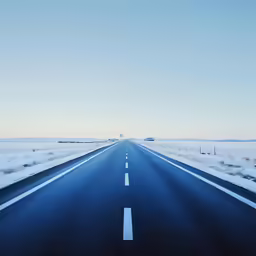 a road in the middle of nowhere with a sky background