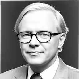 a black and white photo of a man with glasses