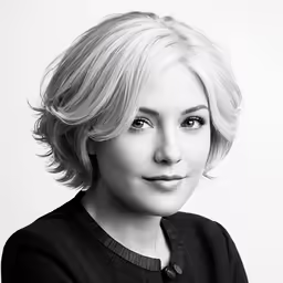 the black and white portrait of a woman wearing a sweater