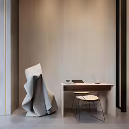 an office space with concrete floors and large wall dividers