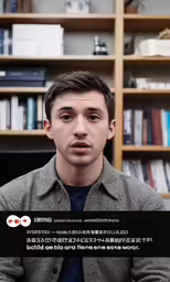 man looking at camera in front of bookshelves